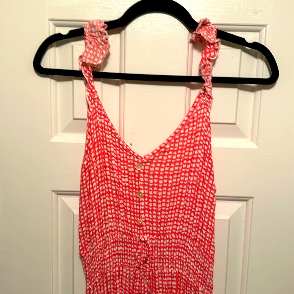 Like new pink and white sundress. The front is higher than the back.